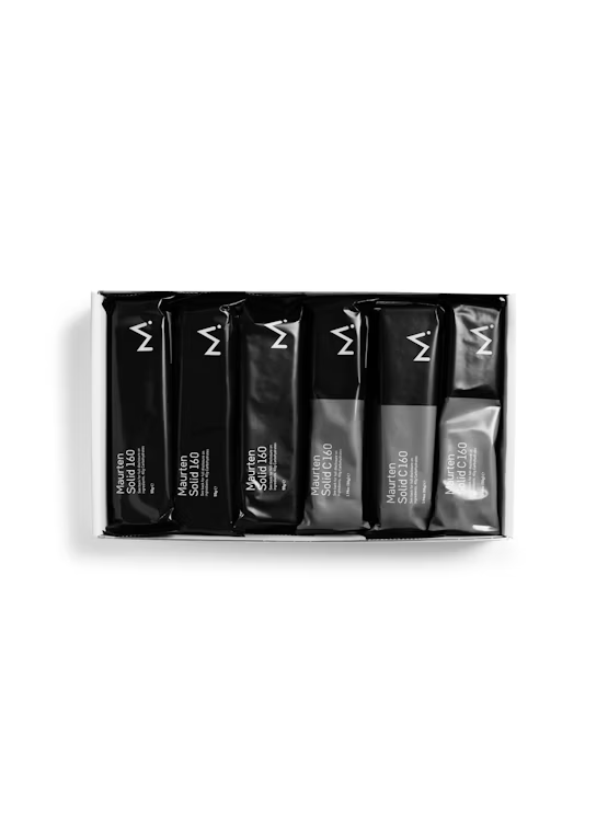 Maurten Solid 160 energy bar multipack with six boxes, showing colorful individually wrapped energy bars for athletes.